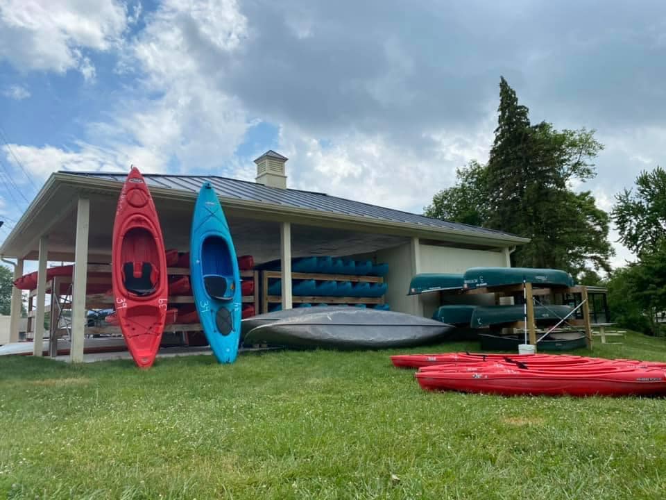 Kayak rental rack at Atwater Paddles in Flat Rock, Michigan, ready for daily paddling adventures.