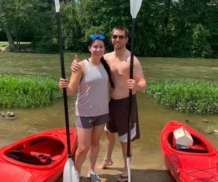 Couple kayaking at Huroc Park in Flat Rock, MI as part of a romantic date idea in Downriver Michigan.