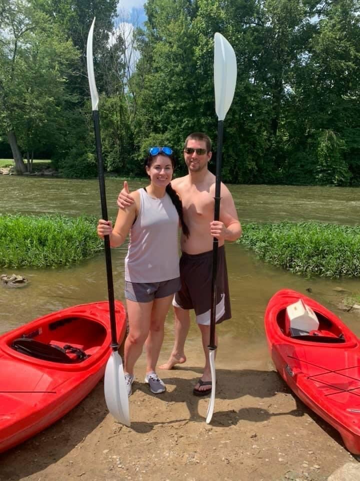 Couple kayaking at Huroc Park in Flat Rock, MI as part of a romantic date idea in Downriver Michigan.